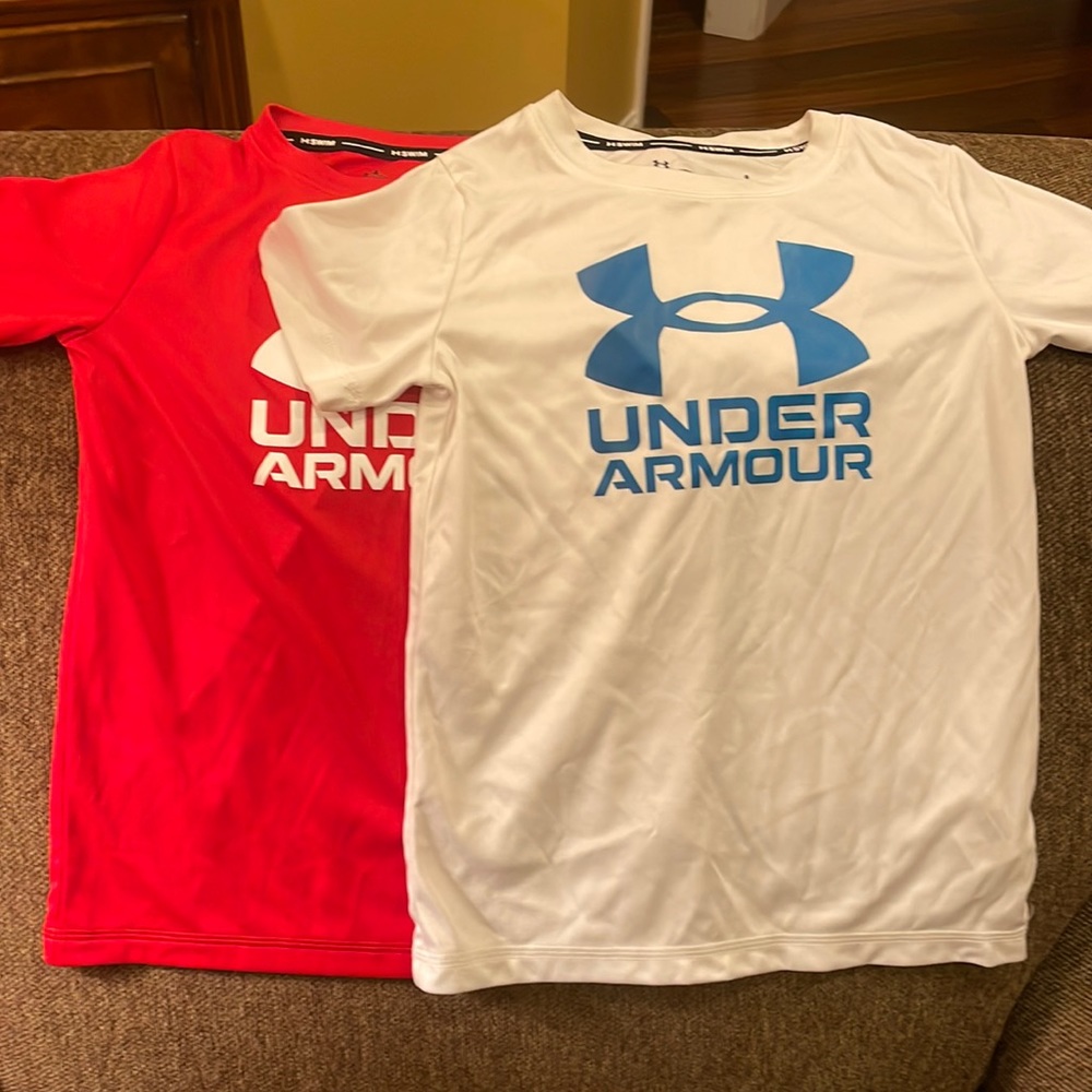 Very good condition Under Armour swim shirts, size 6.